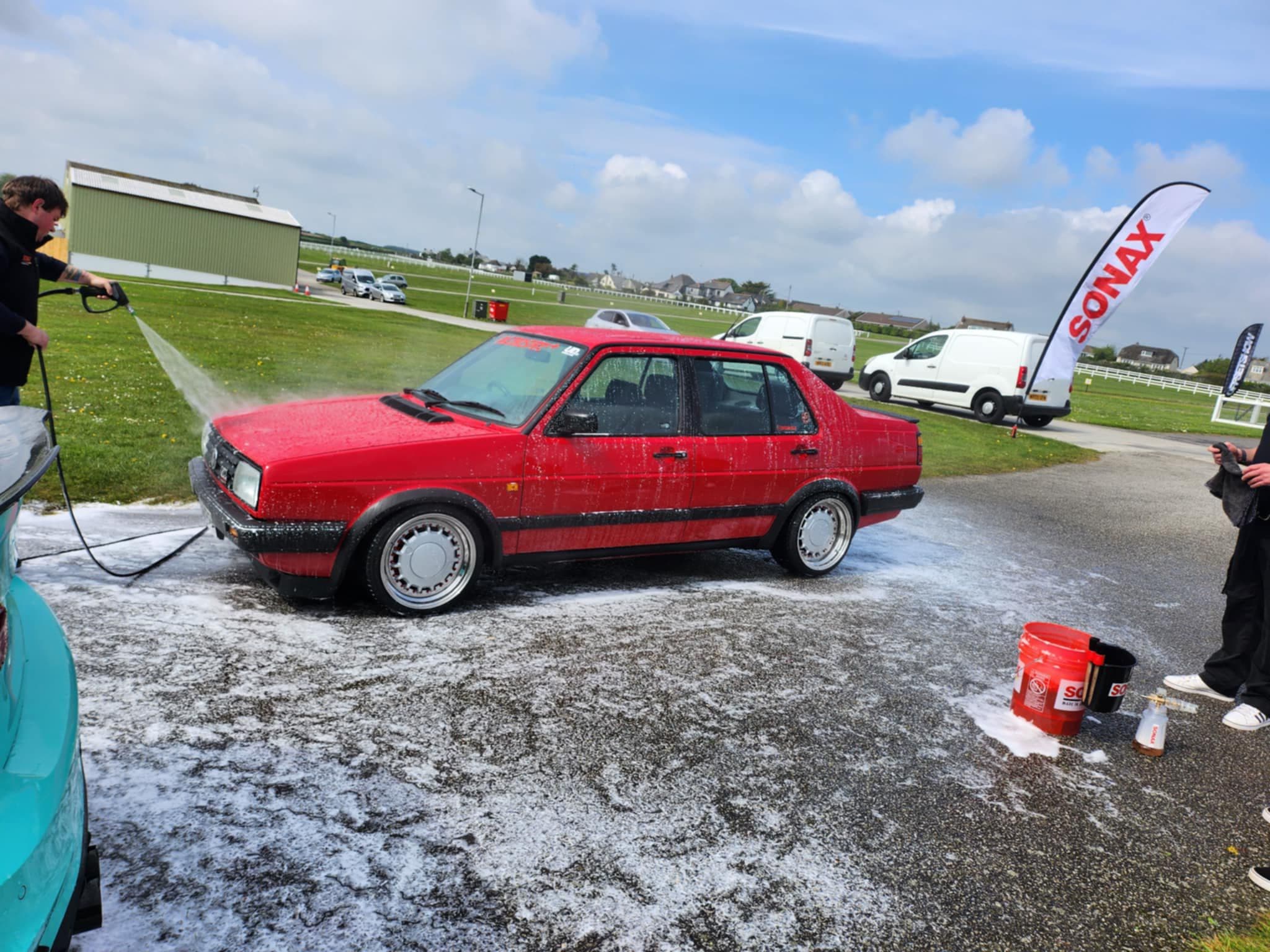 Classic VW Jetta being washed at event
