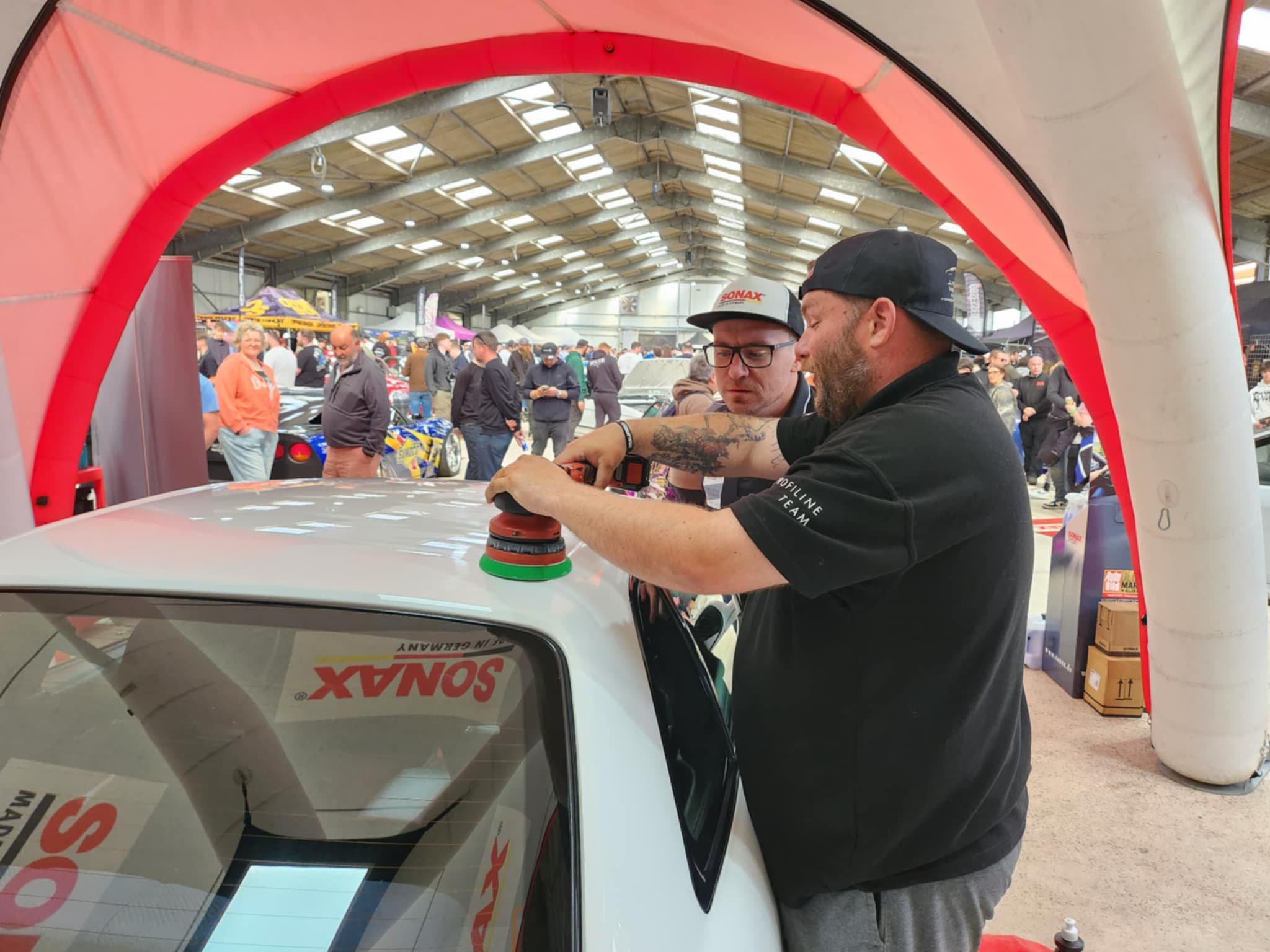 Machine polishing at car show